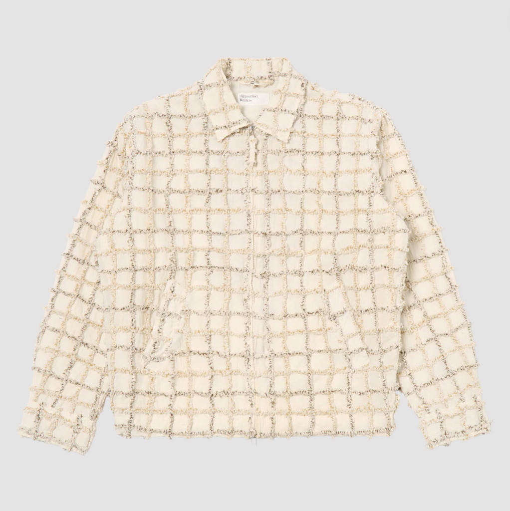 Ecru check cotton jacket with a two-way zip front, chest and hand pockets, and adjustable cuffs and rear waist tabs.