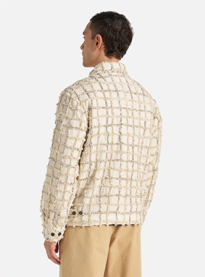 Ecru check cotton jacket with a two-way zip front, chest and hand pockets, and adjustable cuffs and rear waist tabs.