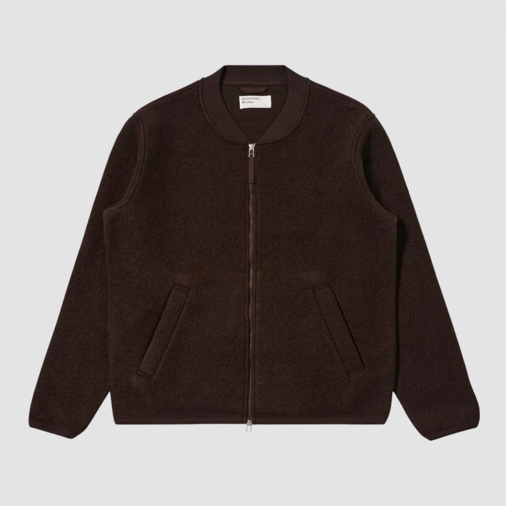 Brown fleece jacket with a zipper on a light gray background.