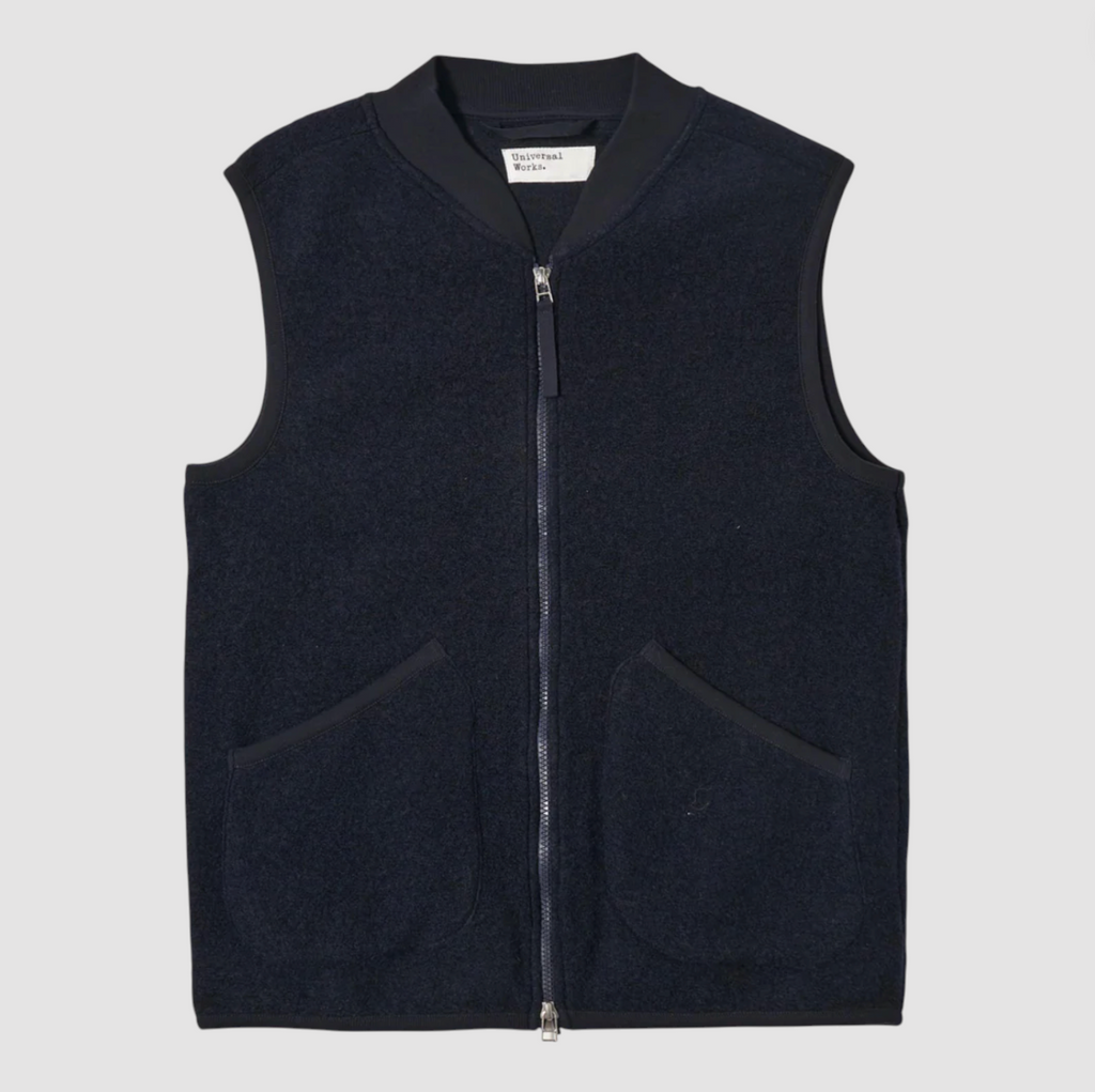 Navy sleeveless vest on a light gray background.