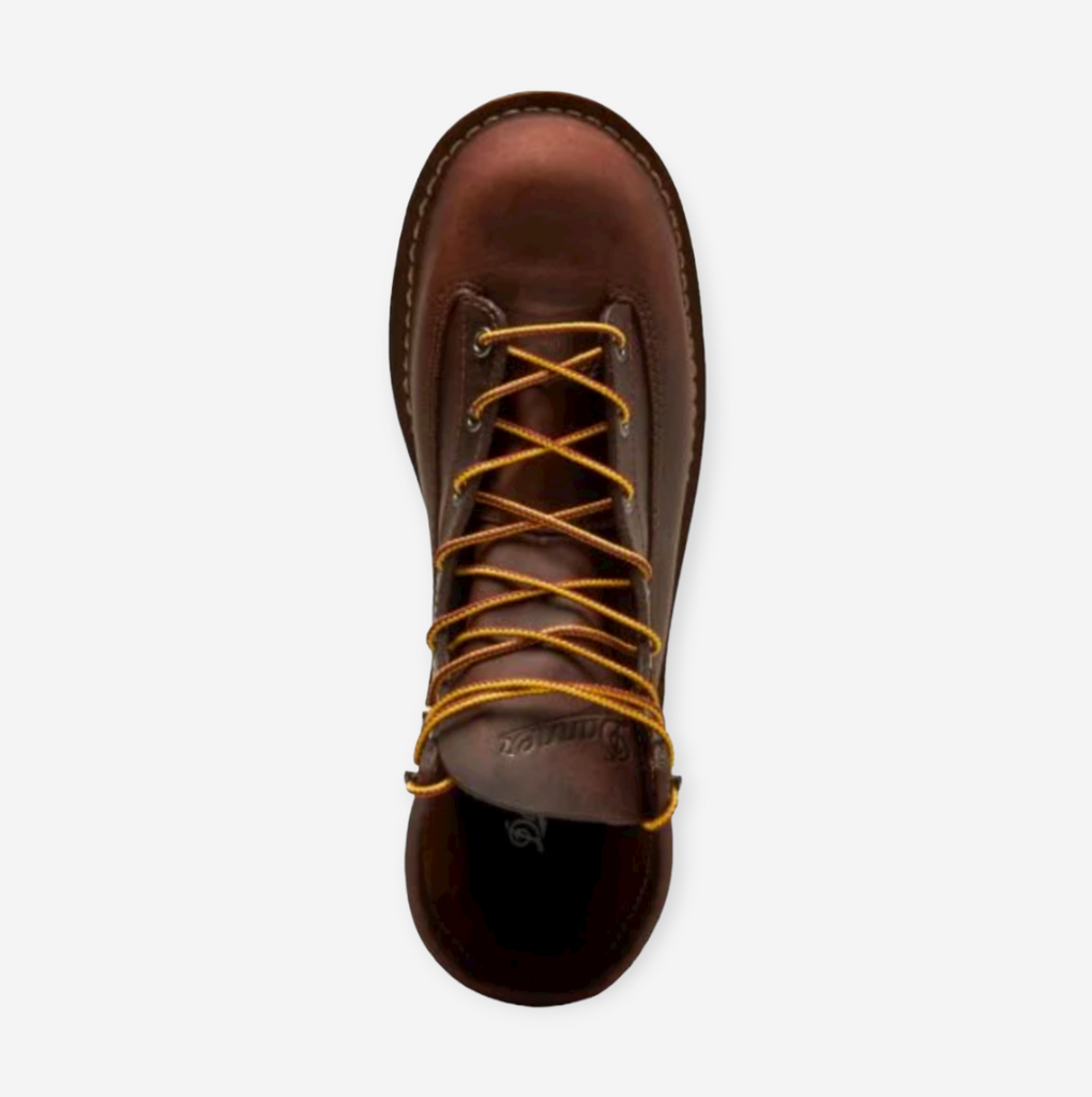 Close-up of Danner Bull Run work boot in brown, featuring full-grain leather, unlined interior, and slip-resistant wedge outsole.