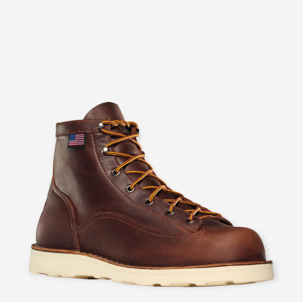 Close-up of Danner Bull Run work boot in brown, featuring full-grain leather, unlined interior, and slip-resistant wedge outsole.