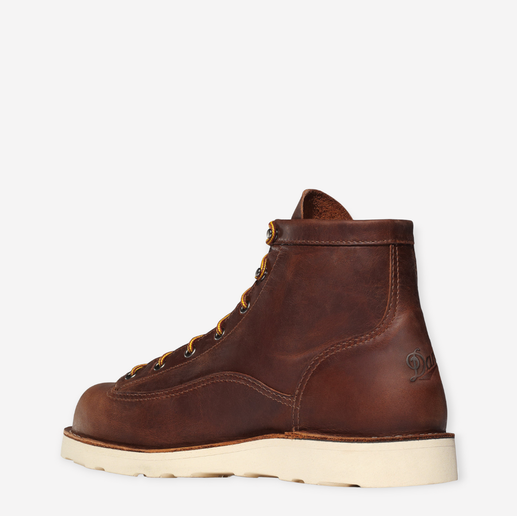 Close-up of Danner Bull Run work boot in brown, featuring full-grain leather, unlined interior, and slip-resistant wedge outsole.