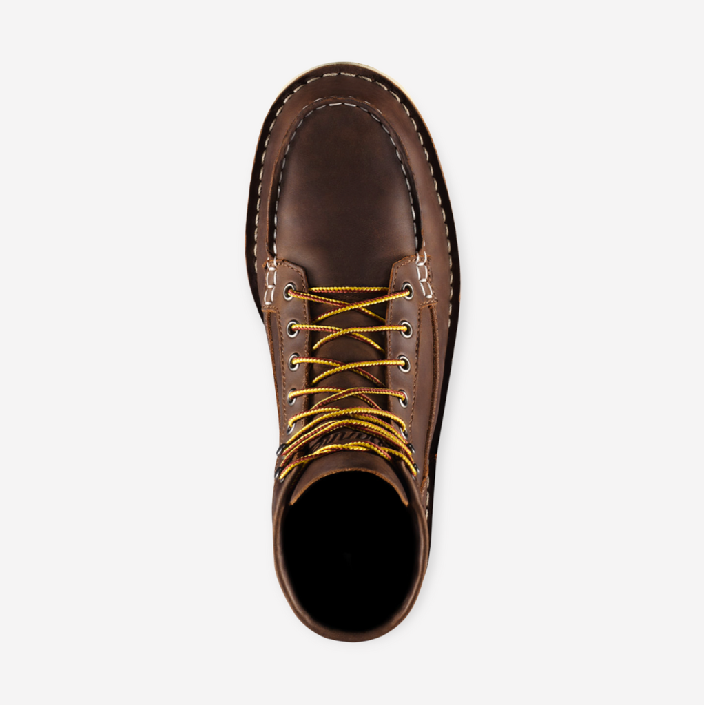 Close-up of Danner Bull Run Moc Toe work boot, featuring a durable brown leather upper, steel toe, and oil-resistant sole.