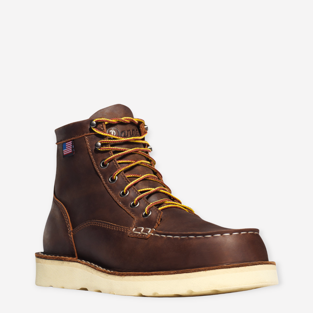 Close-up of Danner Bull Run Moc Toe work boot, featuring a durable brown leather upper, steel toe, and oil-resistant sole.