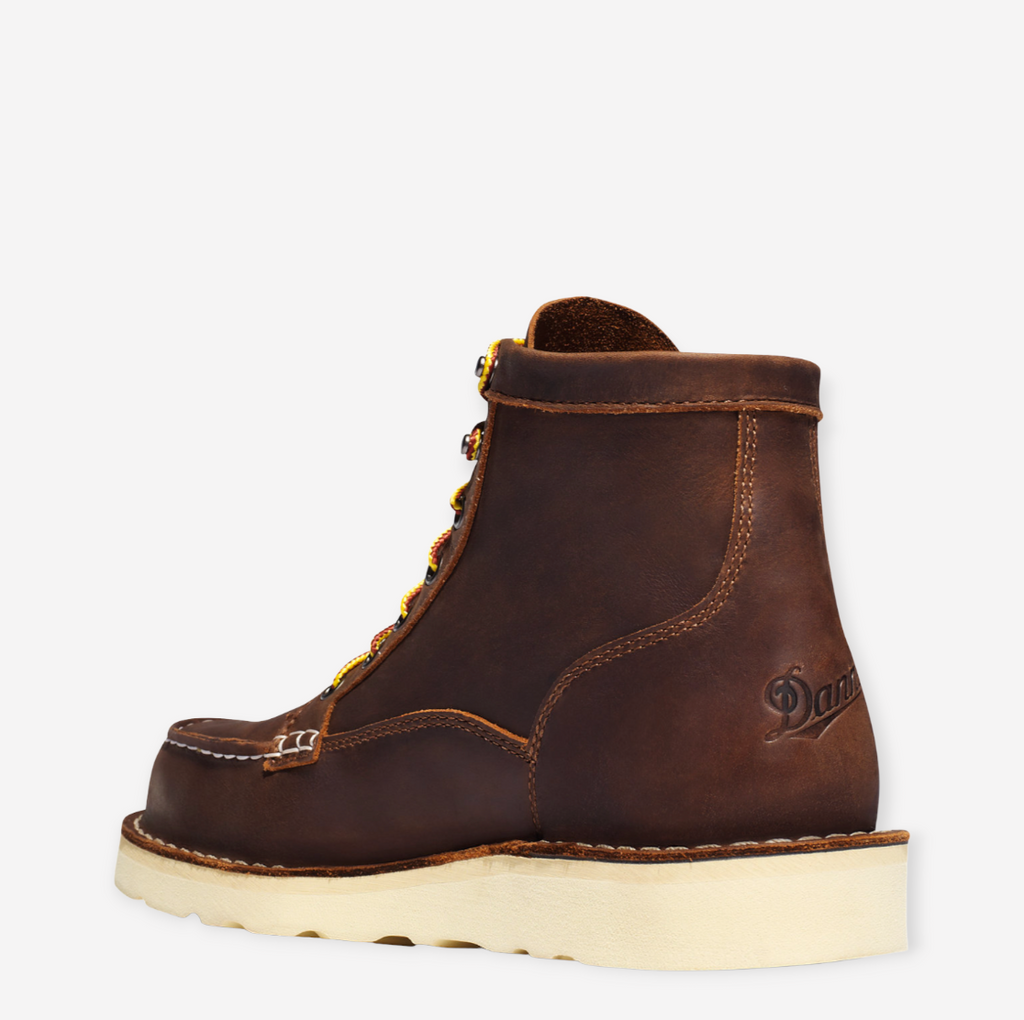 Close-up of Danner Bull Run Moc Toe work boot, featuring a durable brown leather upper, steel toe, and oil-resistant sole.